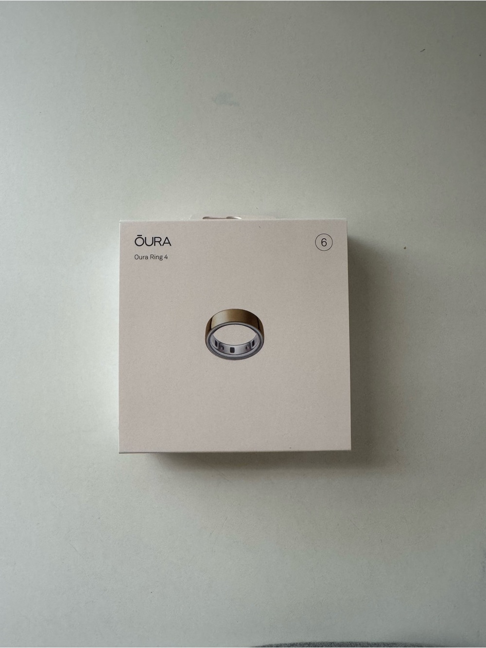 Oura Ring 4 Box with Gold Ring Illustration